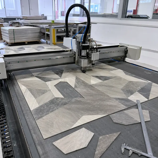 CNC precision cutting station for geometric LVT tile production at Elefloor factory