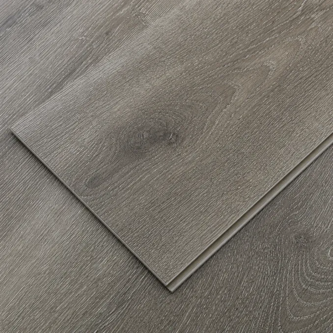 Close-up of embossed-in-register surface texture on luxury LVT plank showing grain alignment