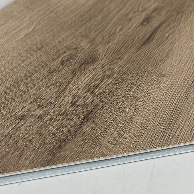 Close-up of embossed-in-register surface texture on luxury LVT plank showing grain alignment with printed décor
