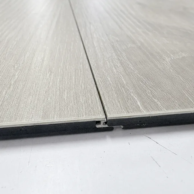 Close-up of LVT click-lock seam with tight ±0.03mm tolerance — wet-area moisture resistance engineering