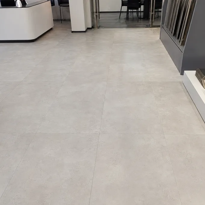 Large-format 457x914mm tile-effect LVT installed in a commercial space showing minimal grout lines