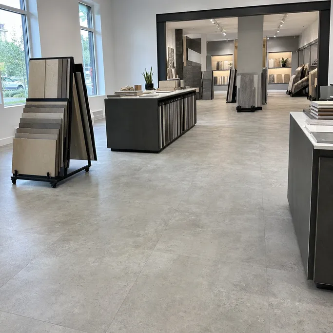 Concrete-look tile-effect LVT flooring in a retail showroom environment
