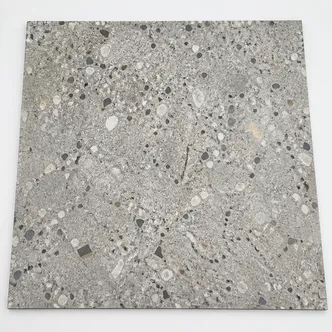 Terrazzo-effect LVT tile with multi-chip pattern and complex color layering