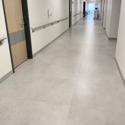 Tile-effect LVT in healthcare corridor with hygienic stone-look surface
