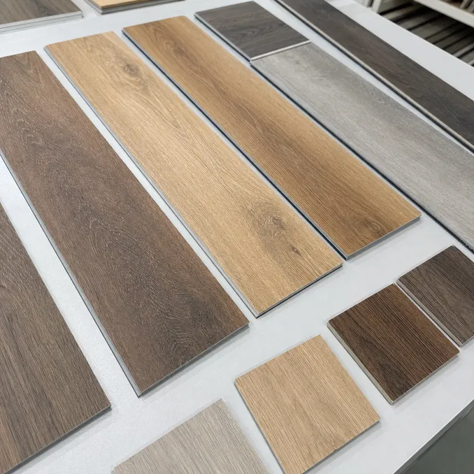 Wood-look LVT production samples showing grain texture and surface finish