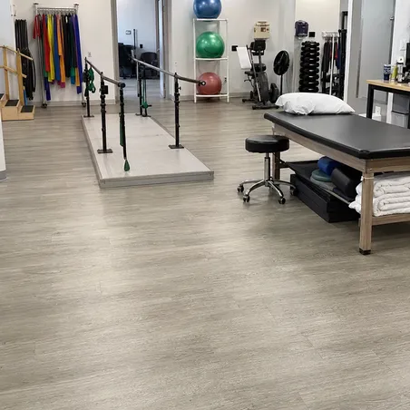 Rehabilitation and physical therapy clinic with slip-resistant SPC flooring for patient safety