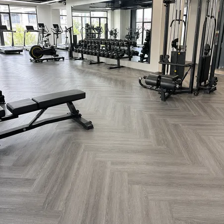 Gym SPC flooring with enhanced indentation resistance in a fitness center