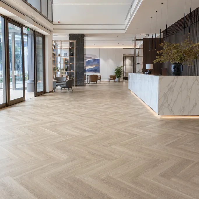 Herringbone SPC flooring in a hotel lobby or boutique commercial fit-out
