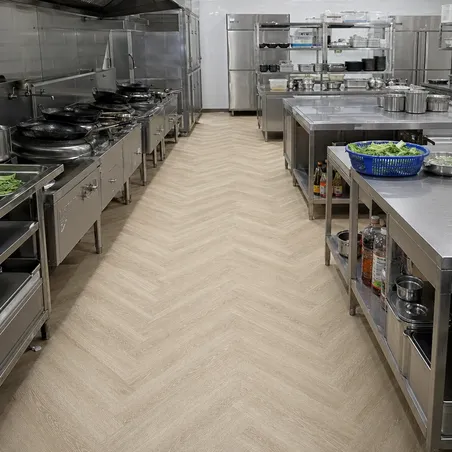 Kitchen SPC flooring with slip-rated surface in a commercial food service kitchen