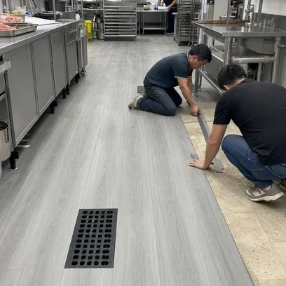 Hotel back-of-house kitchen with click-lock SPC flooring installation