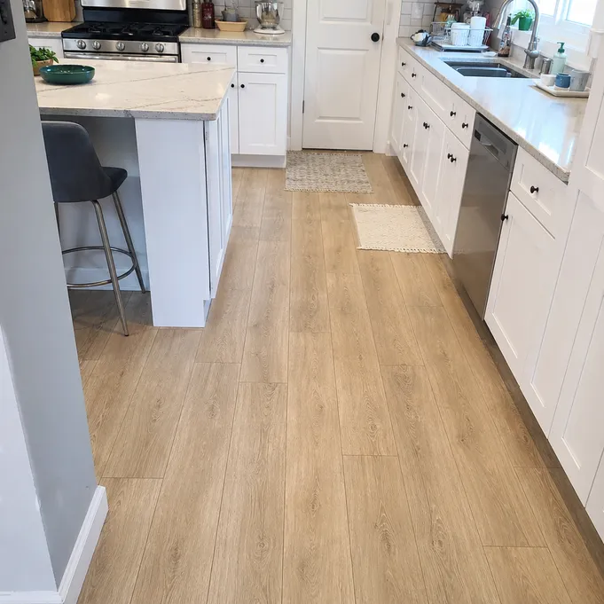 Waterproof SPC flooring installed in a kitchen — showing moisture-resistant rigid core performance