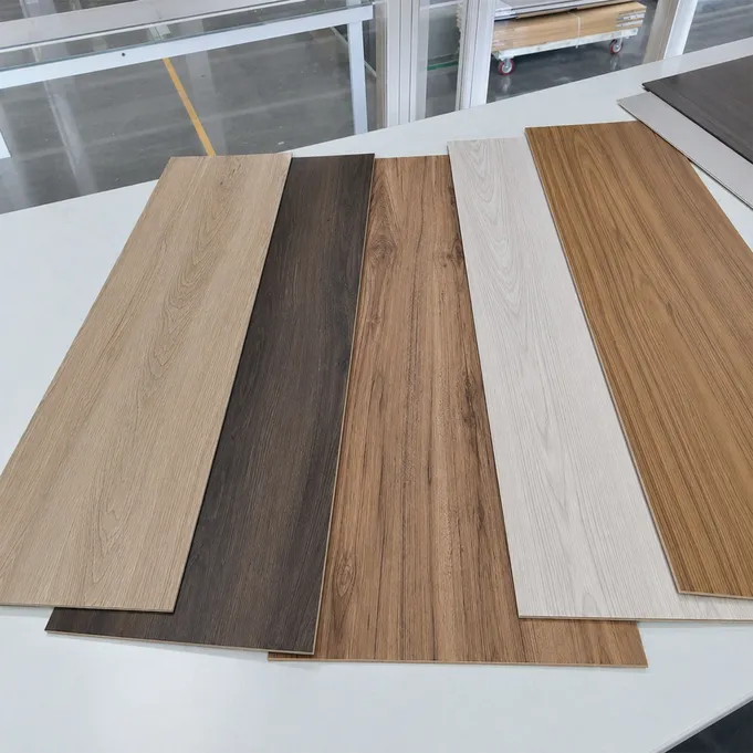 Selection of wood SPC flooring décor films showing oak, walnut, hickory and ash species patterns
