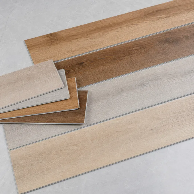 Wood-look SPC flooring planks showing oak, walnut and ash décors with embossed-in-register grain texture