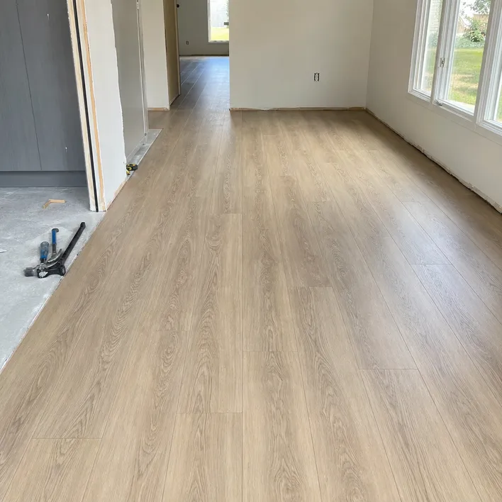 Hardwood SPC flooring installed in a residential renovation — click-lock over concrete slab