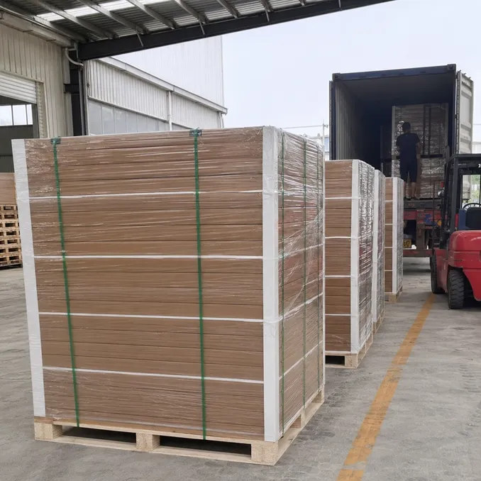 Wood veneer SPC flooring packaged with PE foam interleaf and stacked in cartons ready for container loading