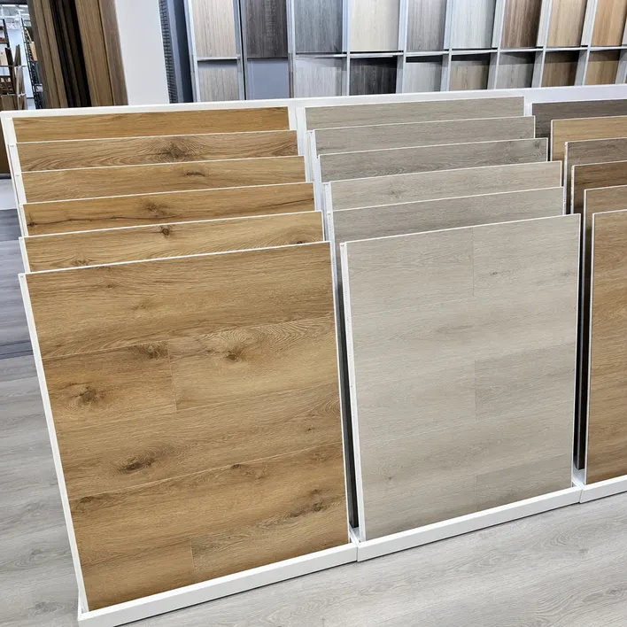 WSPC flooring displayed in retail showroom alongside standard SPC, demonstrating real wood grain upsell opportunity